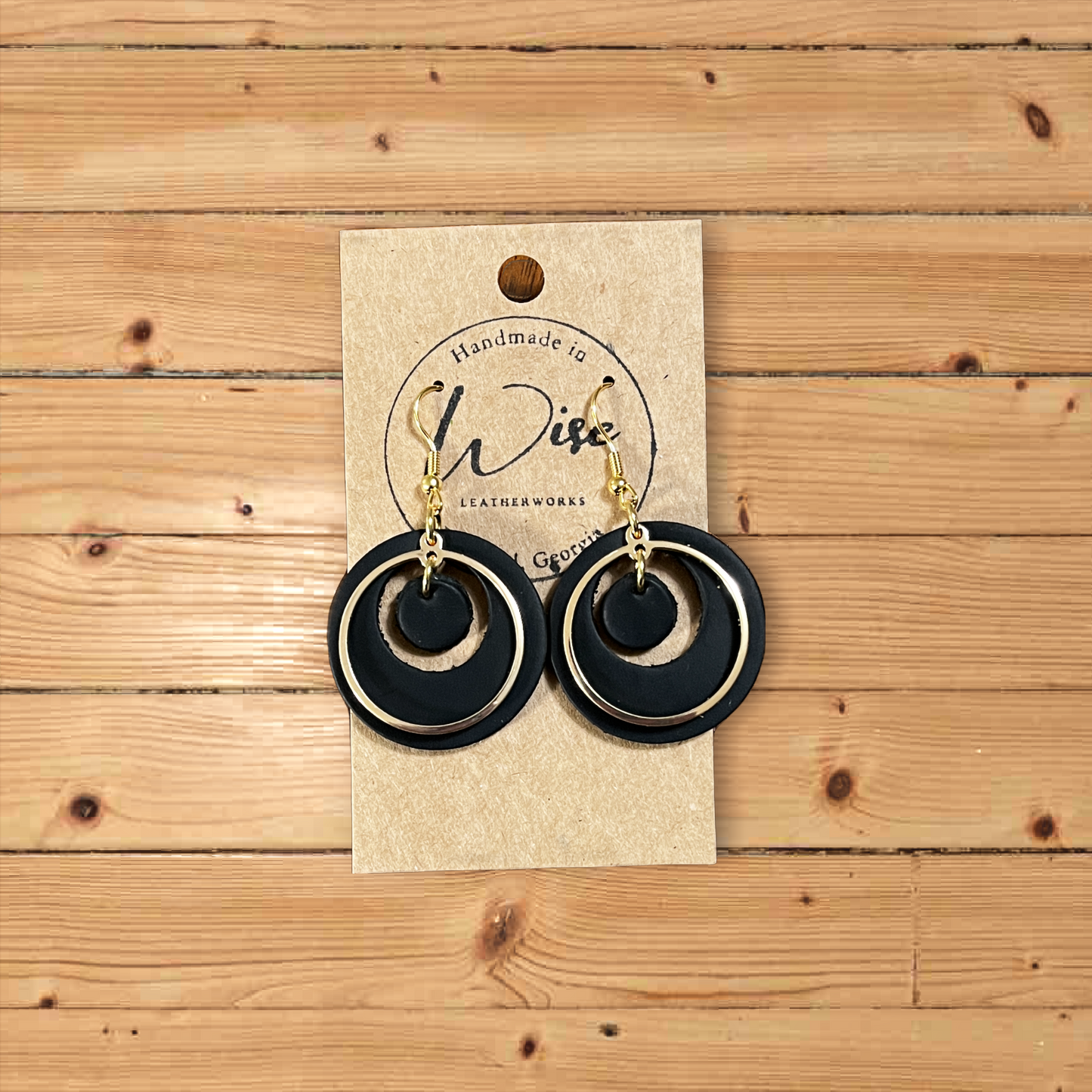 Black leather with gold colored access ring.