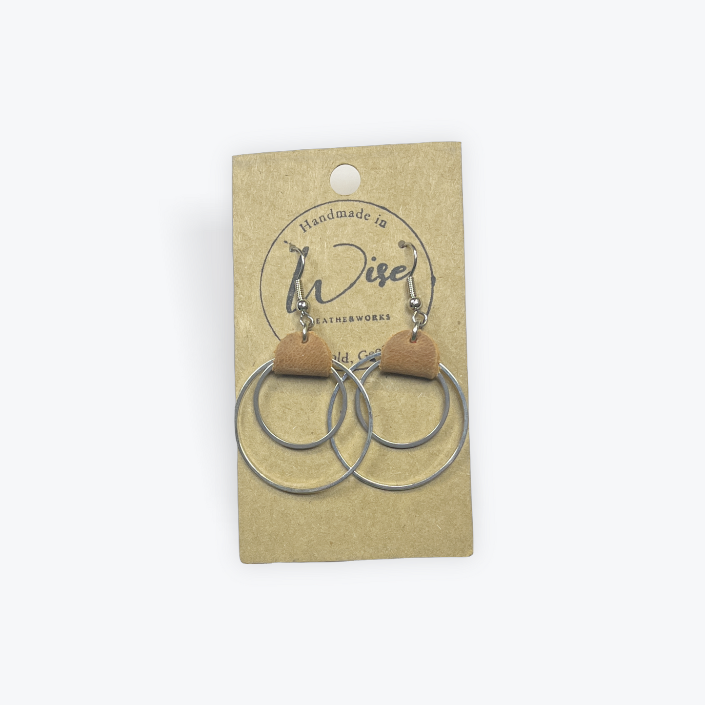 Double metal hoops with brown leather accent earrings. Metal is plain