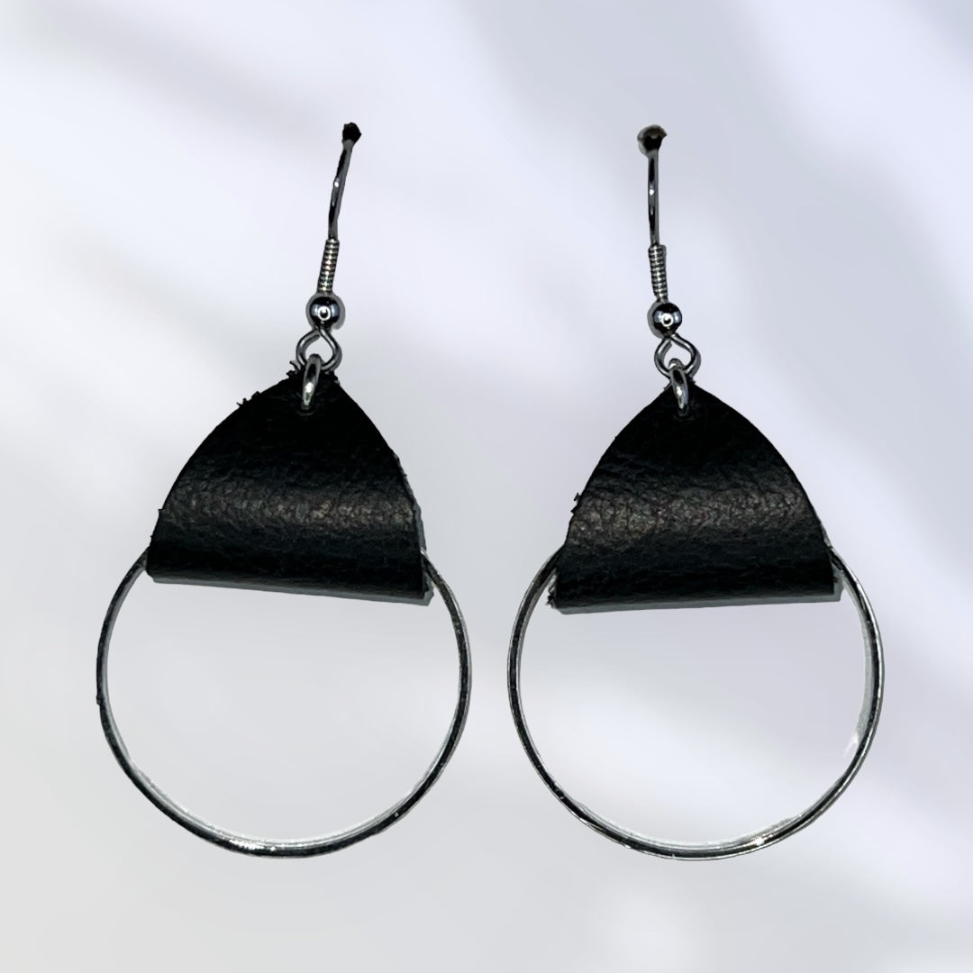 Medium metal hoops with black leather accent earrings. Metal is plain