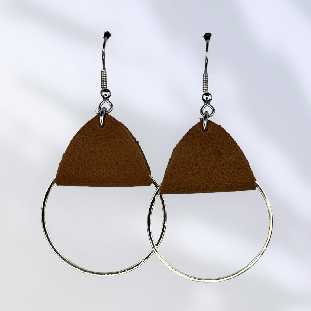 Medium metal hoops with brown leather accent earrings. Metal is plain