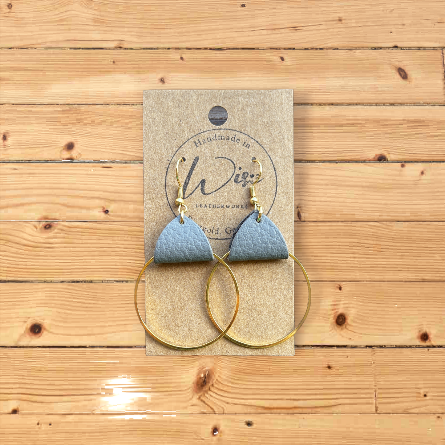 Gray Leather and  Hoop earrings.  Metal is Gold Tone