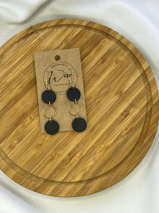 Black leather and gold accents dangle earrings