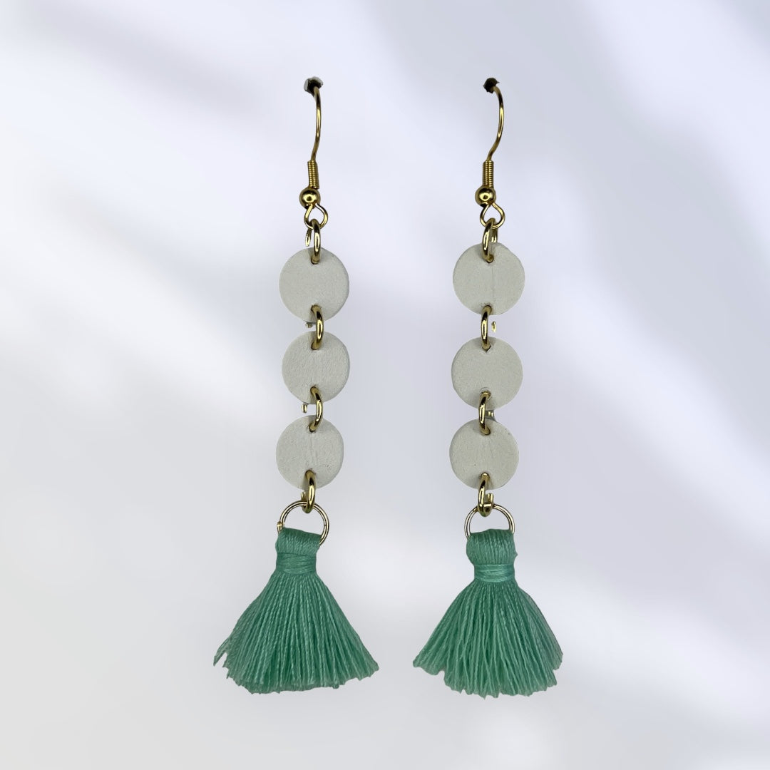 White leather dangle with turquoise tassel